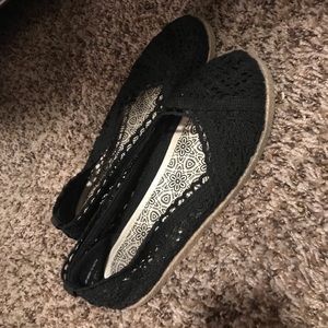 Black knitted flats